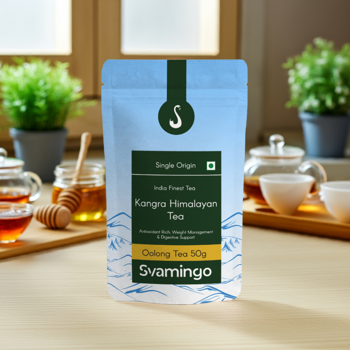 svamingo kangra oolong tea pouch 50g placed on a wooden table in kitchen with honey, tea cups in background